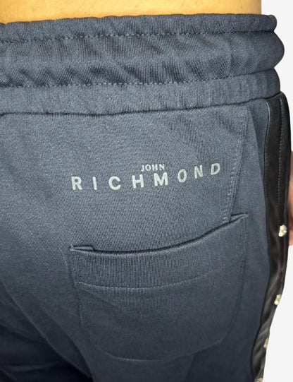 Pantalone John Richmond con dettagli in pelle e metallo uomo