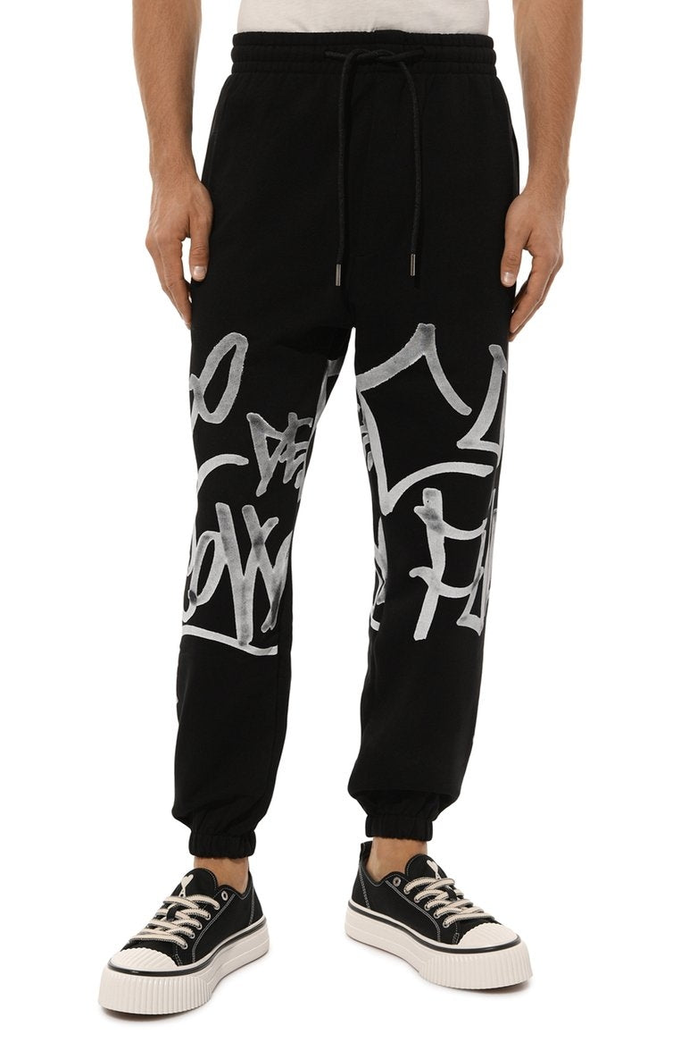 Pantalone Comme des Fuckdown in felpa con logo graffiti uomo