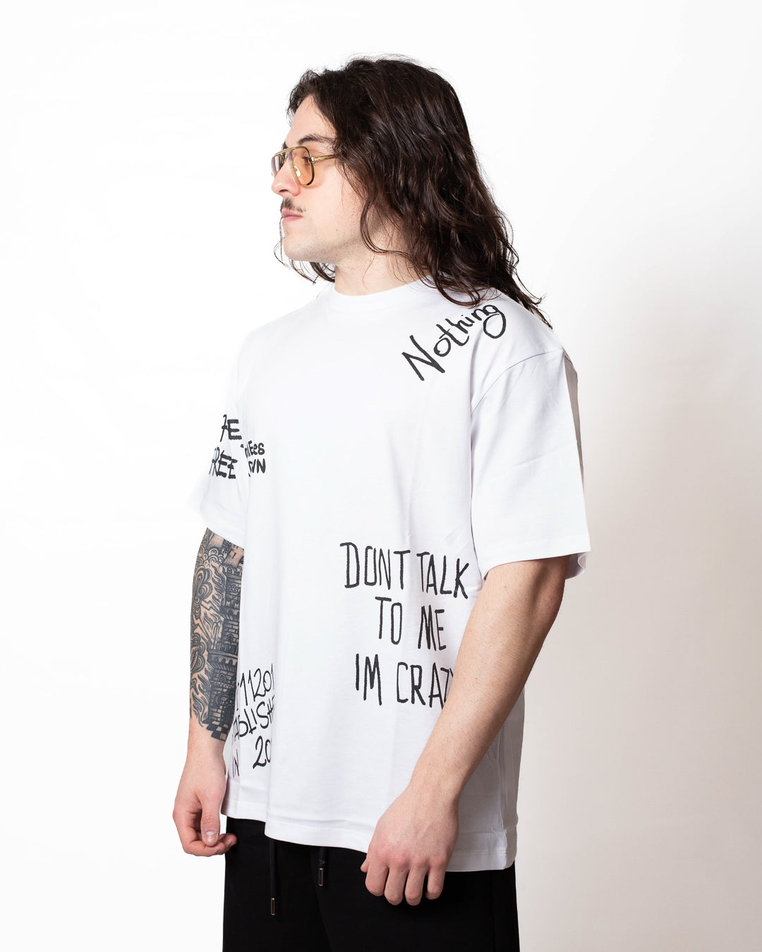 T-Shirt Comme des Fuckdown con stampe all-over uomo