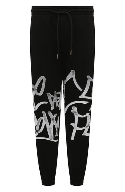 Pantalone Comme des Fuckdown in felpa con logo graffiti uomo