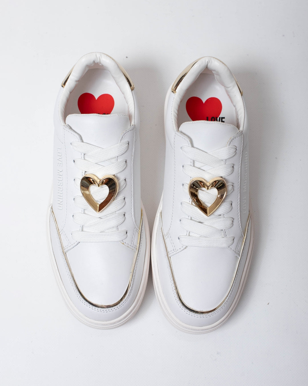 Sneakers Love Moschino con cuore in metallo donna